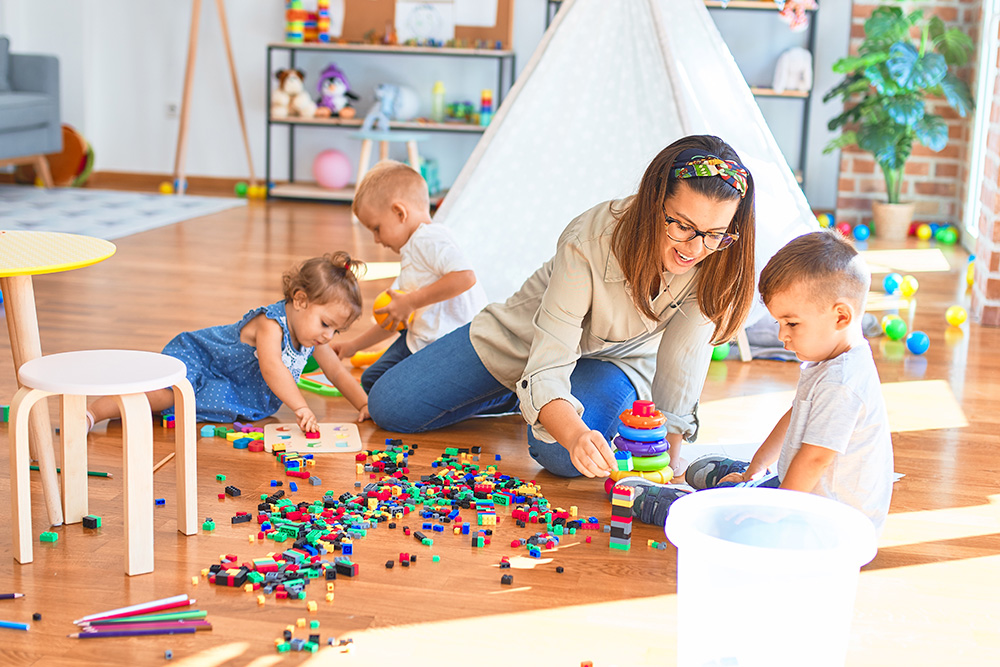 A supportive teacher is helping the kid, highlighting benefits paid time off, and a fun work environment.